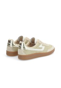 Beige sneakers with a glittery side panel, white accents, and metallic gold heel tab. Rubber sole and textile upper with textured finish.