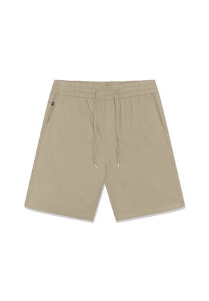 Shorts beige à hauteur des genoux avec taille élastique, cordon de serrage et poches latérales, étalés à plat sur un fond blanc.