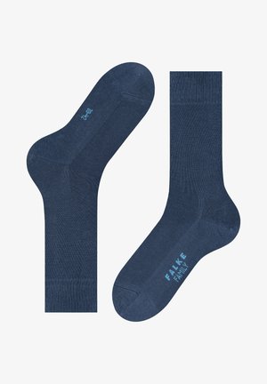 Blaue Baumwollmischsocken mit einer glatten Textur, geripptem Bündchen und verstärkter Zehenpartie, mit hellblauer Markierung auf der Sohle.