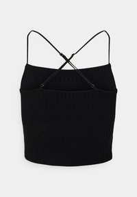 Top corto nero a coste con spalline sottili regolabili incrociate sul retro, presentato su uno sfondo bianco semplice.