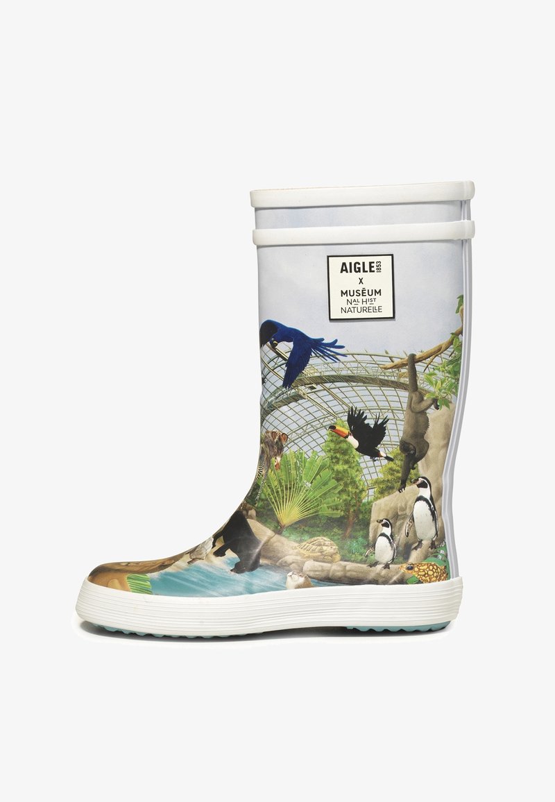 Botte en caoutchouc pour enfant avec des illustrations colorées de la faune, comprenant des oiseaux, des pingouins, un singe et des plantes sous un dôme de verre.