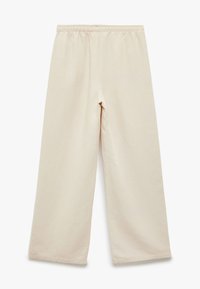Beige weite Hose aus einem weichen Stoff, mit einem elastischen Bund und einer glatten Textur, ohne sichtbare Muster oder Akzente.