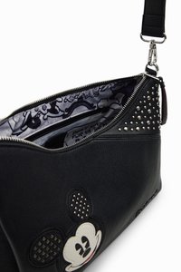Black leather handbag with Mickey Mouse design, studded accents, and a patterned interior. Features a zip closure and adjustable strap.
