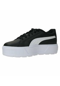 Sneakers in pelle nera con una striscia bianca e suola platform. Presentano punta rotonda, suola in gomma testurizzata e lacci frontali.