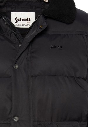 Giacca a vento nera con chiusura a zip, texture trapuntata e dettagli con logo. Presenta un morbido colletto in pile nero e dettagli con bottoni.