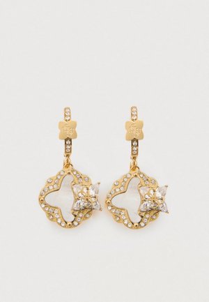 Orecchini in tonalità dorata con un design a fiore ritagliato, impreziositi da strass trasparenti e un accento a stella al centro.