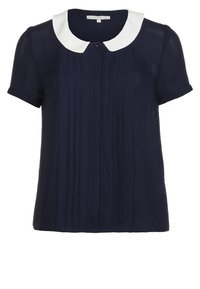 Blouse bleu marine à manches courtes avec col blanc arrondi et plis verticaux sur le devant.