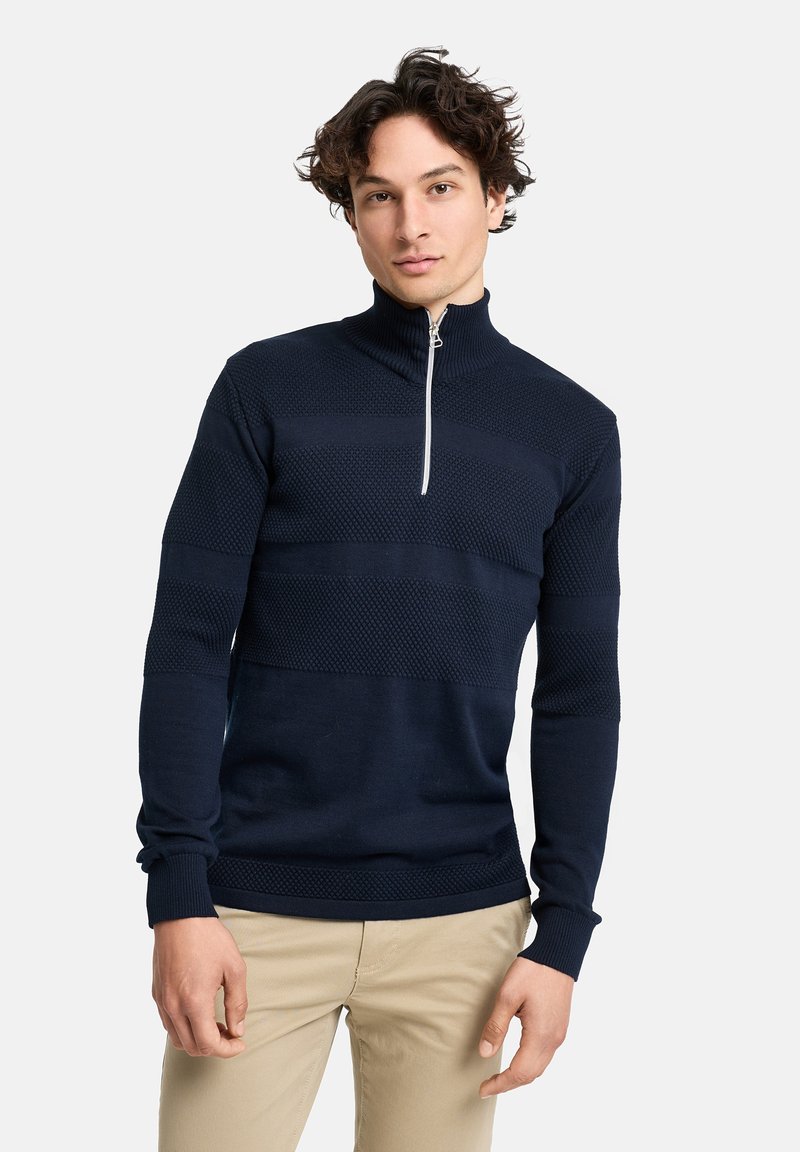 Marineblauer Pullover mit halbem Reißverschluss, strukturierten Mustern, langen Ärmeln und einem gerippten Kragen. Verfügt über einen kontrastierenden silbernen Reißverschluss und subtile horizontale Streifen.