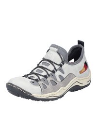 Gray and white sporty shoe with a textured upper, elastic lacing system, and open sections. Curved sole with black grip patterns.