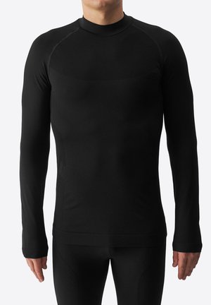Camiseta térmica negra de manga larga con cuello alto, fabricada en un tejido suave y elástico que presenta acentos texturizados en los hombros y los lados.