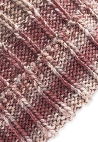 Knit fabric with a diamond pattern, featuring shades of burgundy, beige, and cream. Textured yarn with visible stitches and varied thickness.
