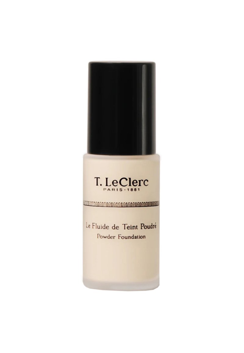 T. LeClerc Puder-Foundation in einer beige Glasflasche mit einem glänzenden schwarzen Deckel. Verfügt über elegante schwarze Schrift und ein dekoratives horizontales Band.
