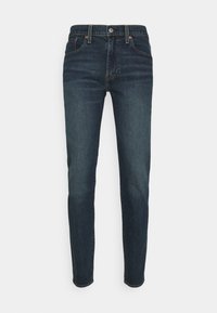 Donkerblauwe denim jeans met een slim fit, voorzien van een vijf-pocket ontwerp, riemlussen en een sluiting met een knoop aan de voorkant.