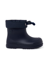 Bottine étanche bleu marine avec serrage réglable par cordon et semelle texturée, conçue pour temps froid ou humide.