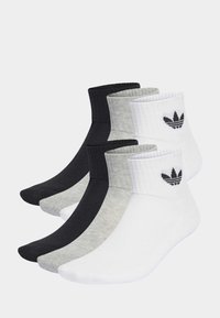 Set sportskih čarapa u crnoj, sivoj i bijeloj boji. Izrađene od tkanine s rebrastim manžetama i detaljem logotipa. Dizajn do gležnja s glatkom teksturom.