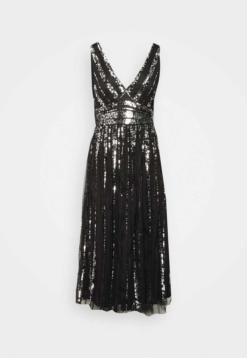 Robe midi noire sans manches à col en V avec sequins argentés verticaux et ceinture ajustée.