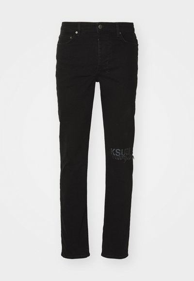 Black denim jeans featuring a slim fit, five-pocket design, a front button closure, and distressed accents with a logo on the leg.