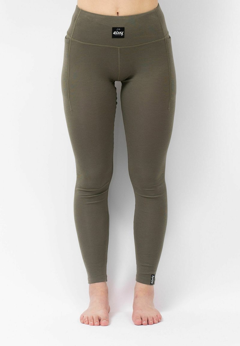Olijfgroene legging gemaakt van ribbelmateriaal met een hoge taille; heeft een klein logolabel nabij de enkel.
