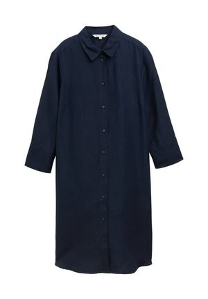 Marineblauwe linnen overhemddress met lange mouwen, knoopsluiting aan de voorkant en klassieke kraag. Heeft een losse, ontspannen pasvorm met zijopeningen.