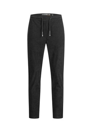 Sorte sweatpants laget av myk stoff, med snøring i livet, smale ben og subtile teksturdetaljer. Ingen synlige mønstre eller aksenter.