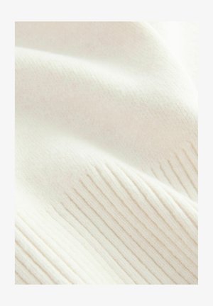 Soft, creamy white fabric with subtle ribbed texture and gentle folds, suggesting warmth and comfort.