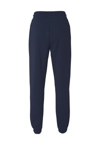 Navyblauwe joggers gemaakt van zachte, rekbare stof. Voorzien van een elastische tailleband en taps toelopende benen met geprofileerde zoom. Geen zichtbare patronen.