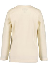 Langärmliges Kinderoberteil aus off-white Baumwolle. Gerundeter Ausschnitt, gestickter Saum und glatte Textur mit minimalen Design-Details.