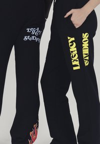 LEGACY STUDIOS ORION UNISEX - Treniņtērpa apakšdaļas - black