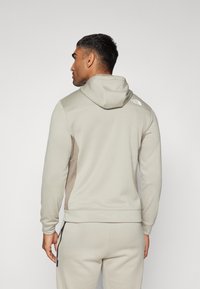 The North Face Jakna od flisa - clay grey/cavern grey