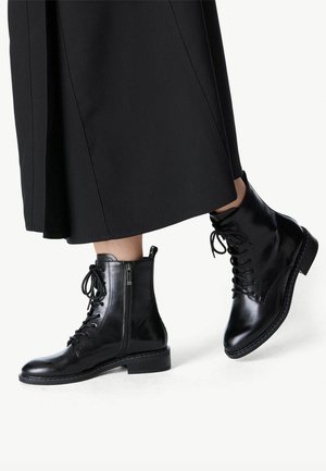 Black leather ankle boots featuring a lace-up front, side zipper, smooth texture, and a low block heel.