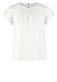 Blouse blanche à manches courtes avec détails en dentelle sur les manches et le haut de la poitrine, col rond, et fermeture éclair au dos.