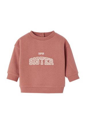 Rosa Sweatshirt mit kurzen Ärmeln, ausgestattet mit einem Rundhalsausschnitt und Druckknopfverschluss. Auf der Vorderseite steht "SUPER SISTER" in Ecru mit einem dekorativen Muster.