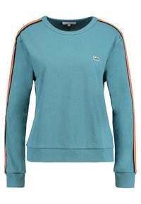 Felpa teal con maniche lunghe, colletto a giro e polsini a coste. Presenta strisce arancioni e nere lungo le maniche. Logo piccolo sul petto.