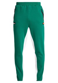 Gröna och vita avsmalnande sweatpants med elastisk midja, svarta dragkedjefickor på sidorna och små varumärkeslogotyper på höfterna.