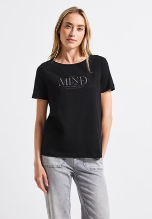 Black cotton T-shirt with a round neckline and short sleeves. Features a printed design saying "MAKE YOUR MIND A NICE PLACE TO BE" in gray.