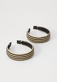 Set of two headbands featuring alternating black and gold woven stripes, with a smooth black inner lining for comfort.