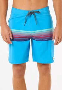 Pantaloni da bagno blu con vita regolabile tramite cordino, caratterizzati da strisce orizzontali a gradiente in viola e turchese nella parte inferiore.