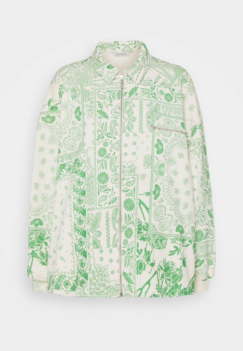 Giacca cream con zip, decorata con un motivo patchwork di fiori verdi e paisley, colletto e tasca con zip sul petto.