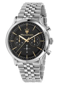Rustfrit stål ur med sort skive, gyldne detaljer, chronograph-funktioner, sølvmaske-bånd og en poleret urkasse. Har tre underskiver.