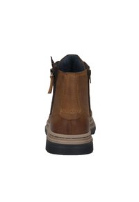 Bruine leren enkellaars met een gladde afwerking, met een zijrits, een gewatteerde kraag en een rubberen zool voor grip.