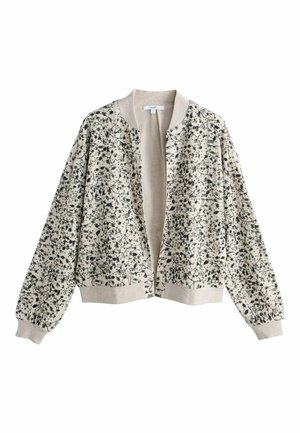 Világos bézs, nyitott elejű bomberdzseki fekete virág- és madármintával, bordázott gallérral, mandzsettával és szegéllyel.