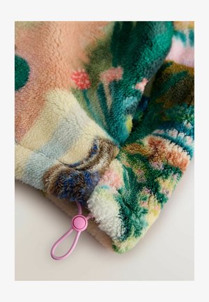 Flauschige, mehrfarbige Decke mit floralem Muster. Verfügt über eine weiche Textur, abgerundete Kanten und eine rosa Kordel an der Ecke.