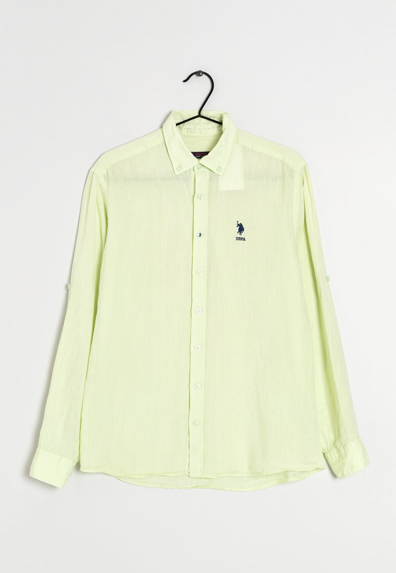 Ljusgul långärmad skjorta med knäppning i kragen, framknappar, broderad logotyp och knappar vid cuffen.