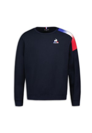 Sudadera azul marino con cuello redondo, puños acanalados y dobladillo. Presenta acentos rojos y azules en el hombro, y logo en el pecho.