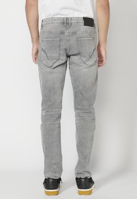 Koroshi STRETCH  - Pieguloša piegriezuma džinsi - denim gris   grey denim