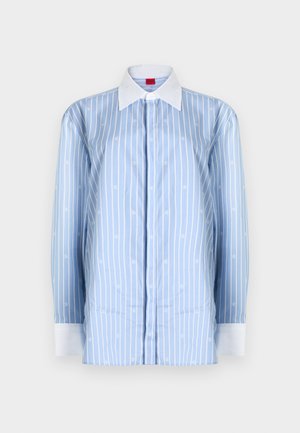 Light blue long-sleeve shirt featuring white vertical stripes and subtle logo patterns. Classic collar and white cuff accents.
