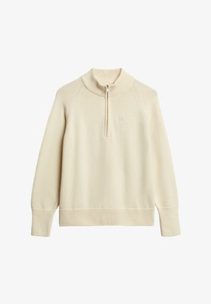 Crème-kleurige, lange mouwen trui met een ritskraag. Beschikt over geribbelde details bij de kraag en manchetten, en een subtiele logo op de borst.