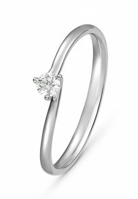 Schlanker, polierter Silberring mit einem runden, klaren Diamanten, der in einer Krappenfassung eingesetzt ist, und der das minimalistische Design sowie die glatte Textur hervorhebt.