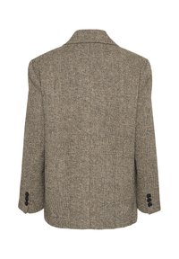 Beige ja musta houndstooth-mustriiga bleiser, millel on lõhikool ja pikad varrukad ning kolme nupuga mansetid. Tekstuuriga kangas.