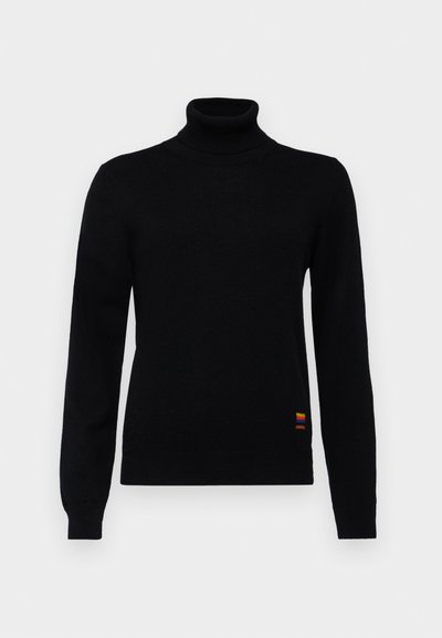 Black turtleneck sweater made of soft fabric, featuring long sleeves and a small multi-colored stripe detail at the hem.